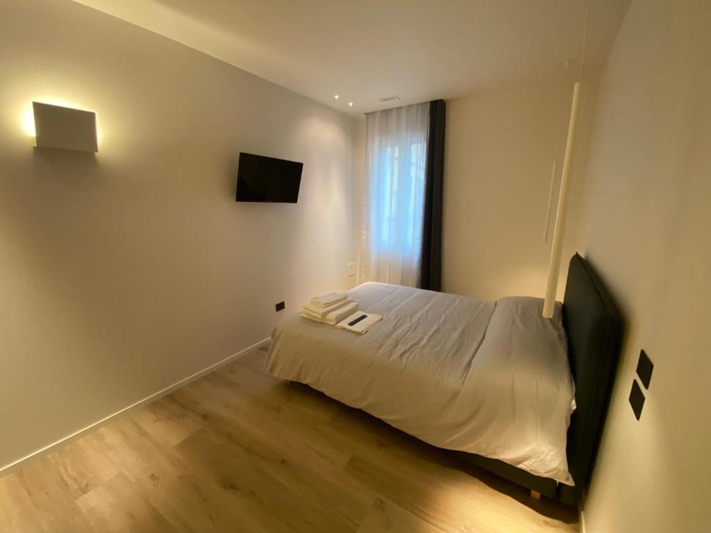 Postel nebo postele na pokoji v ubytování Prato della Valle Apartments