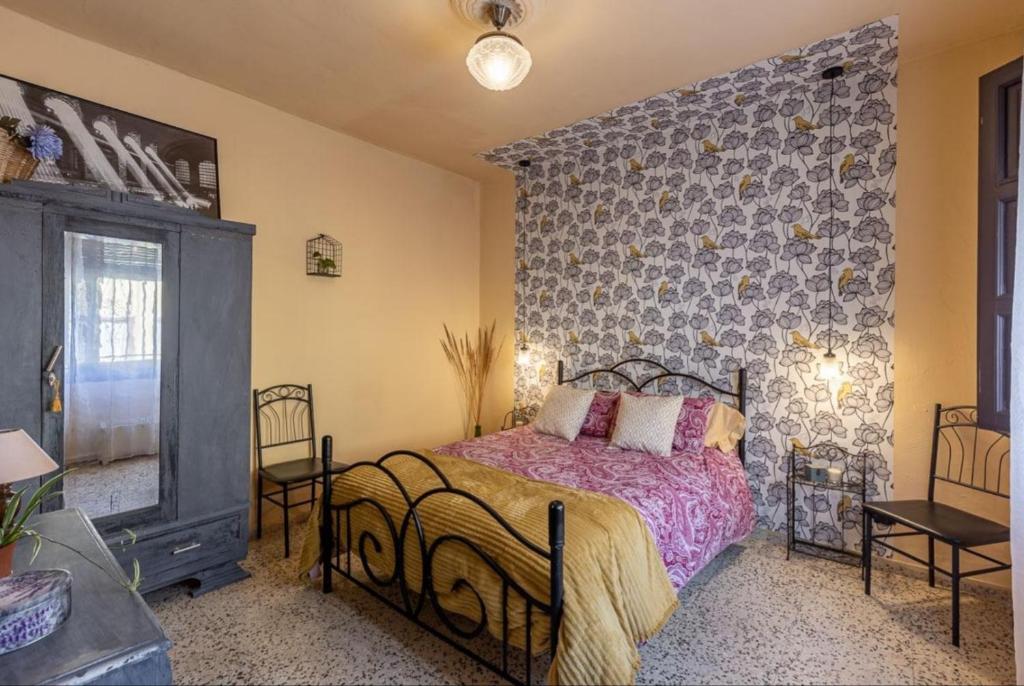 Łóżko lub łóżka w pokoju w obiekcie La nana de Lorca coqueta casa a 15 min de Granada