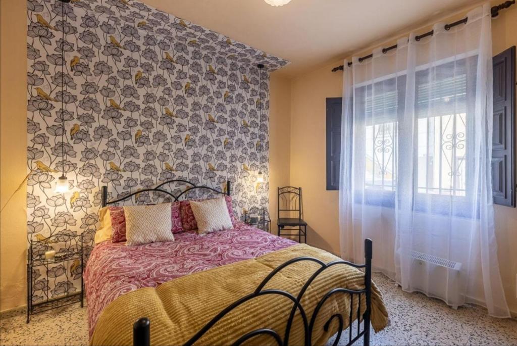 Łóżko lub łóżka w pokoju w obiekcie La nana de Lorca coqueta casa a 15 min de Granada
