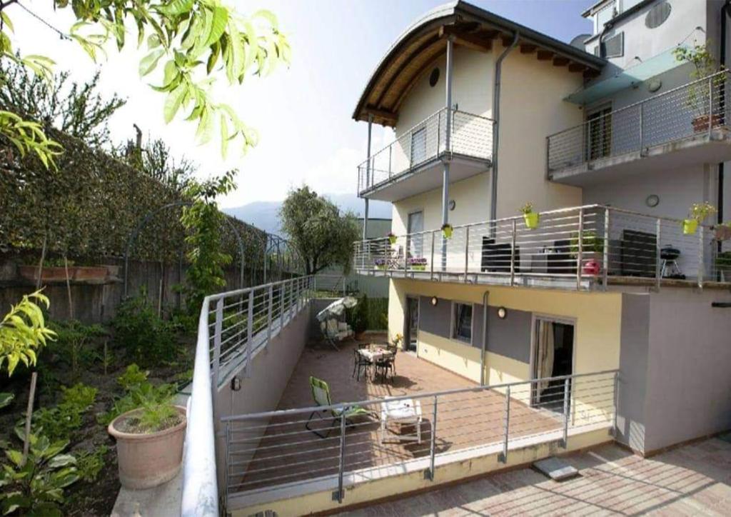 a balcony of a house with a deck and a building at Casa Vela in Riva del Garda