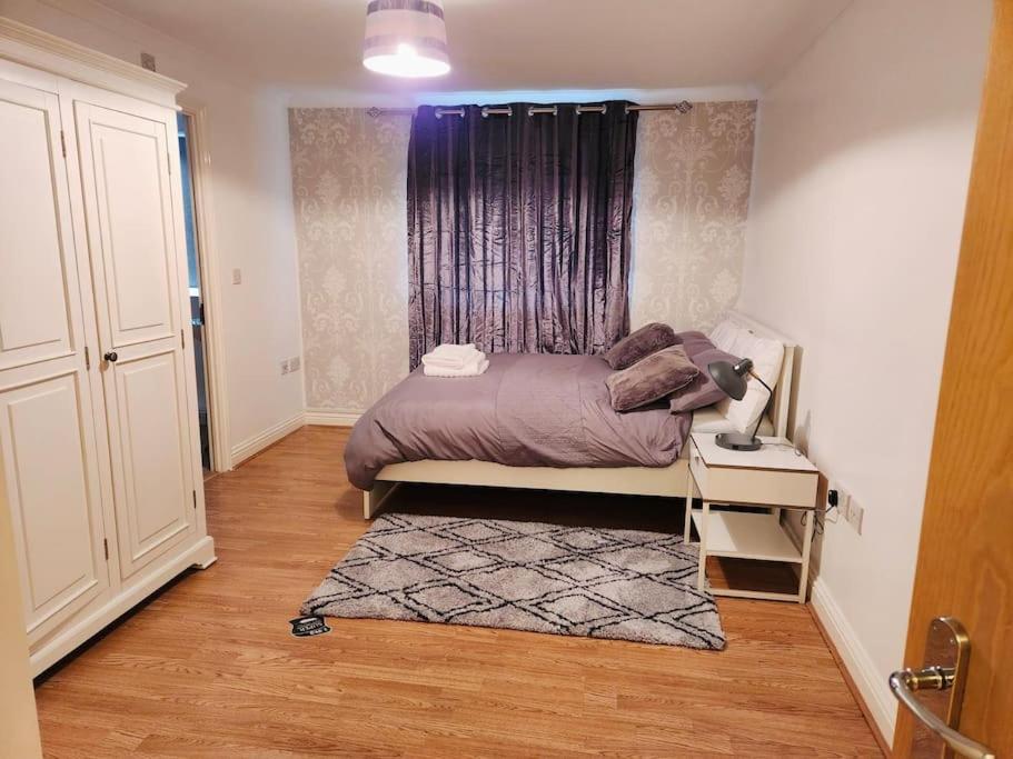 a small bedroom with a bed and a window at RGM Hatfield 2 Bedroom Apartment in Hatfield