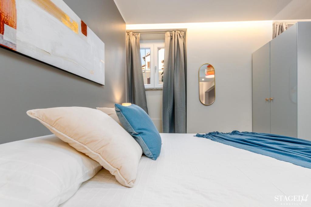 A bed or beds in a room at FEEL - Grand Alta Apartment