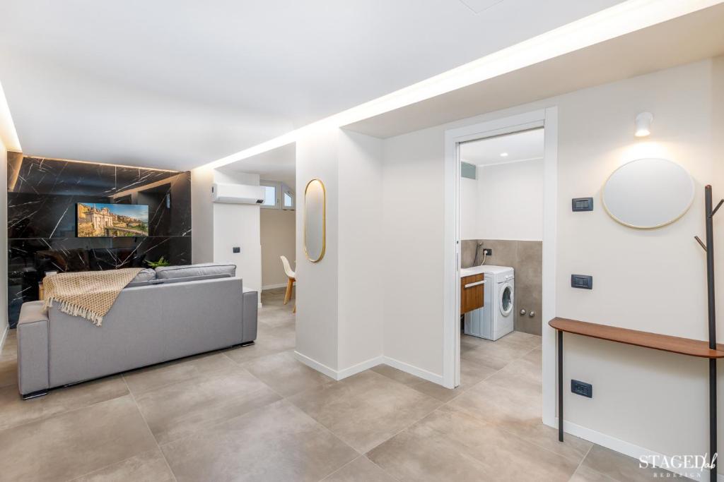 A bed or beds in a room at FEEL - Grand Alta Apartment