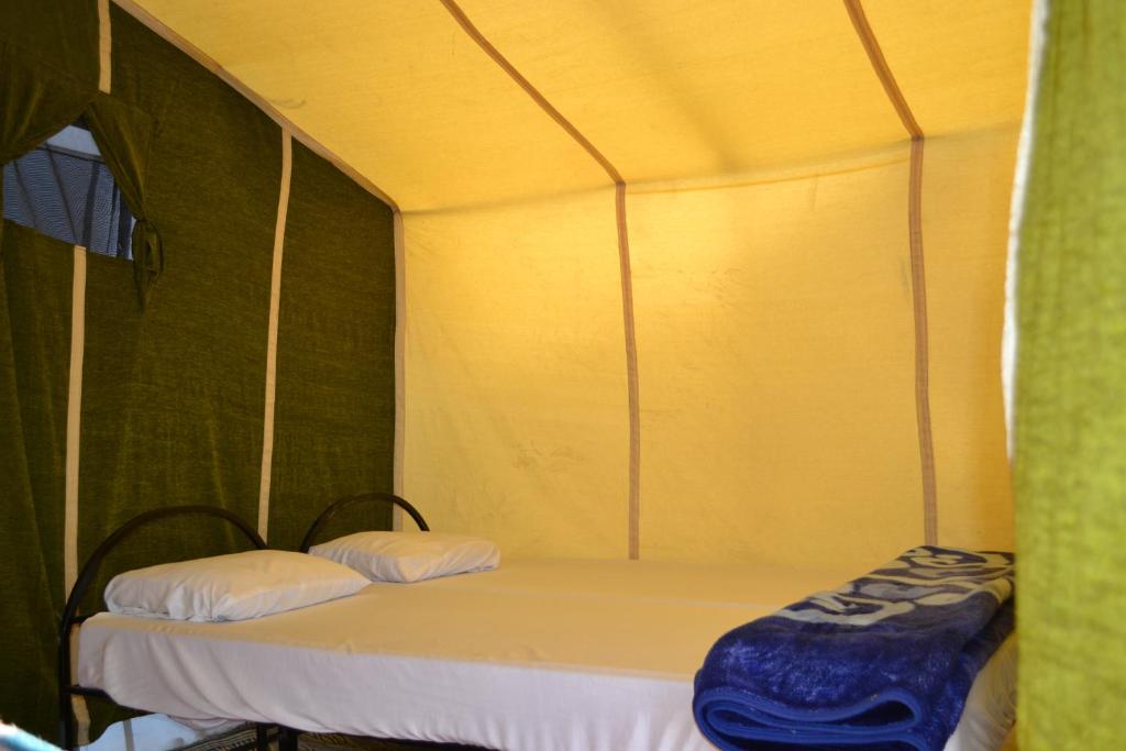 Letto o letti in una camera di Mhamid Sahara Camp - Mhamid El Ghizlane