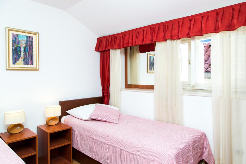 Posteľ alebo postele v izbe v ubytovaní Apartments Lepur