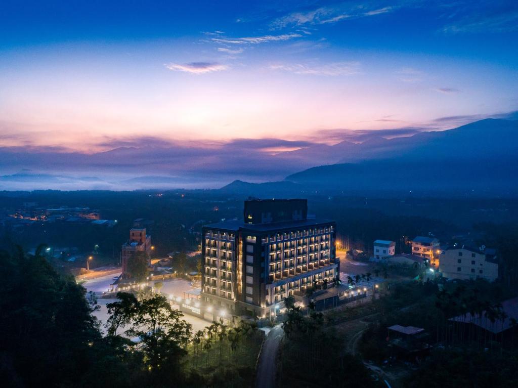 a city skyline at night with a building at Fantasy Palace in Yuchi