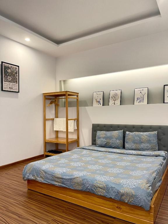 Postel nebo postele na pokoji v ubytování Tuan Long Da Lat Hostel
