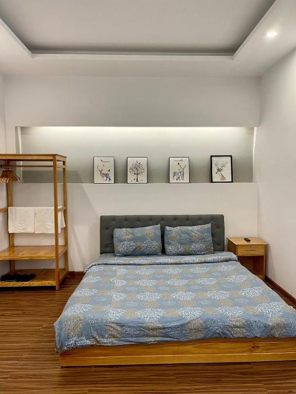 Postel nebo postele na pokoji v ubytování Tuan Long Da Lat Hostel