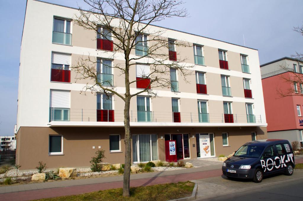 a building with a car parked in front of it at east Apart in Erlangen