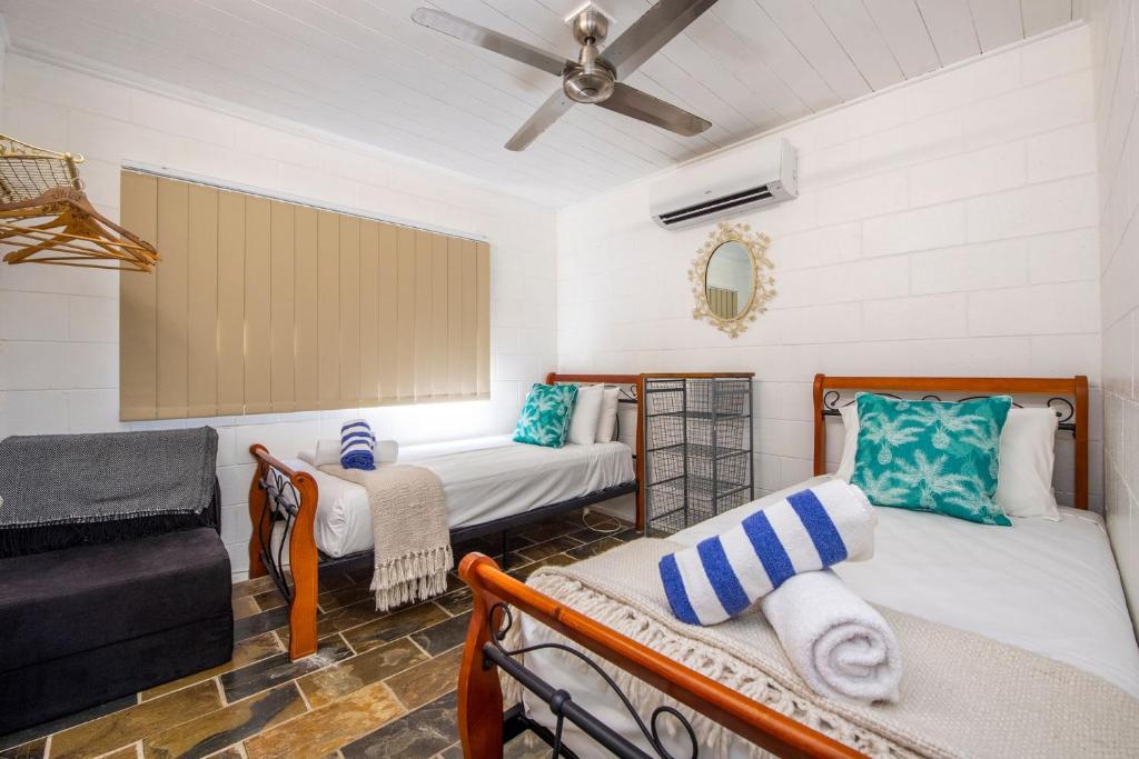 a living room with two beds and a couch at Island View Apt 1 in Arcadia