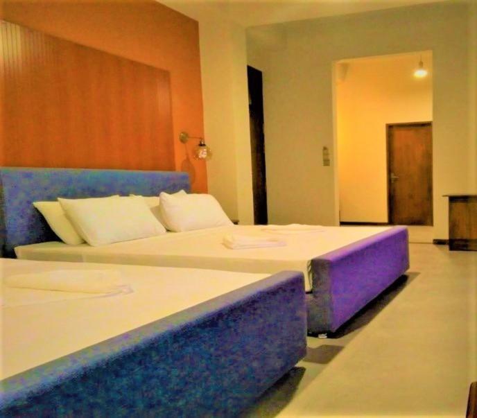 Postel nebo postele na pokoji v ubytování Sooriya Wessagiri Resort