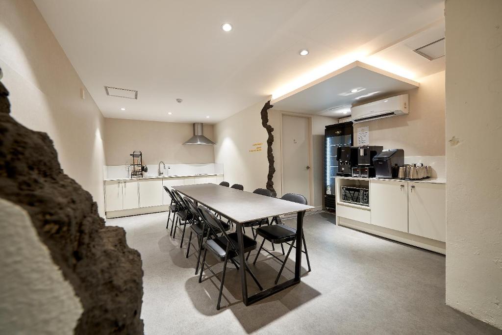 a kitchen and dining room with a table and chairs at Life in Euljiro in Seoul