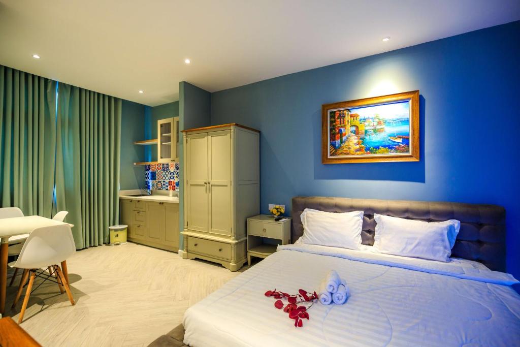 Giường trong phòng chung tại The Bok Hotel Grand World - by GoGo Phú Quốc