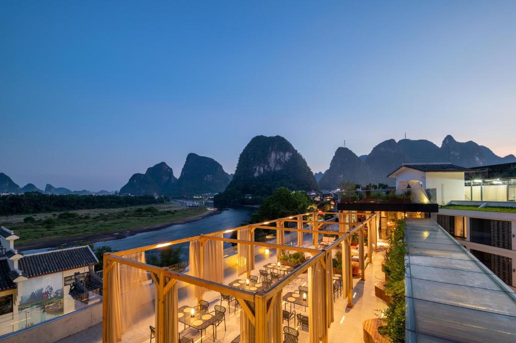 a view of the li river from the balcony of a hotel at Percent Hotel Yangshuo in Yangshuo