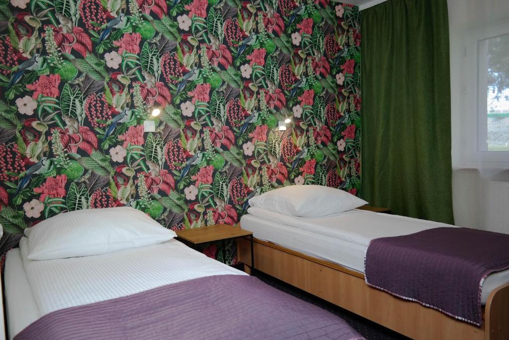 מיטה או מיטות בחדר ב-Hotel George