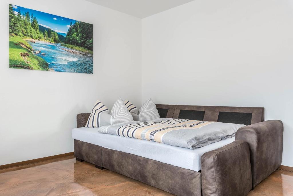 Postel nebo postele na pokoji v ubytování Trojer Apartment 1
