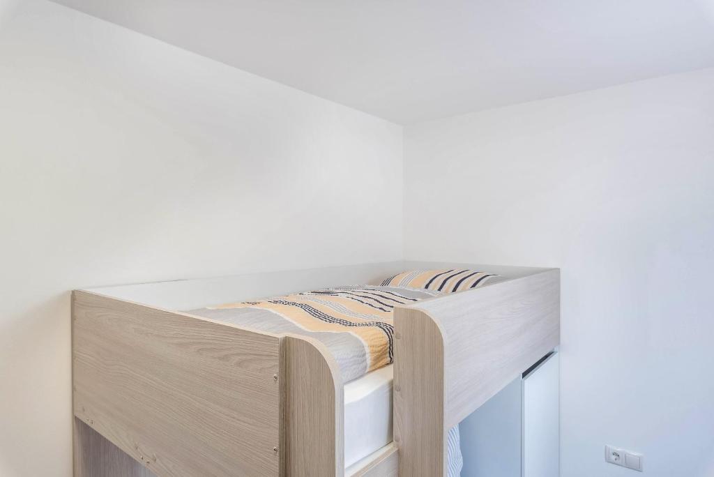 Postel nebo postele na pokoji v ubytování Trojer Apartment 1