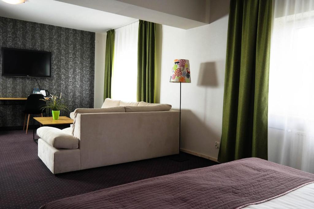 TV a/nebo společenská místnost v ubytování Hotel George