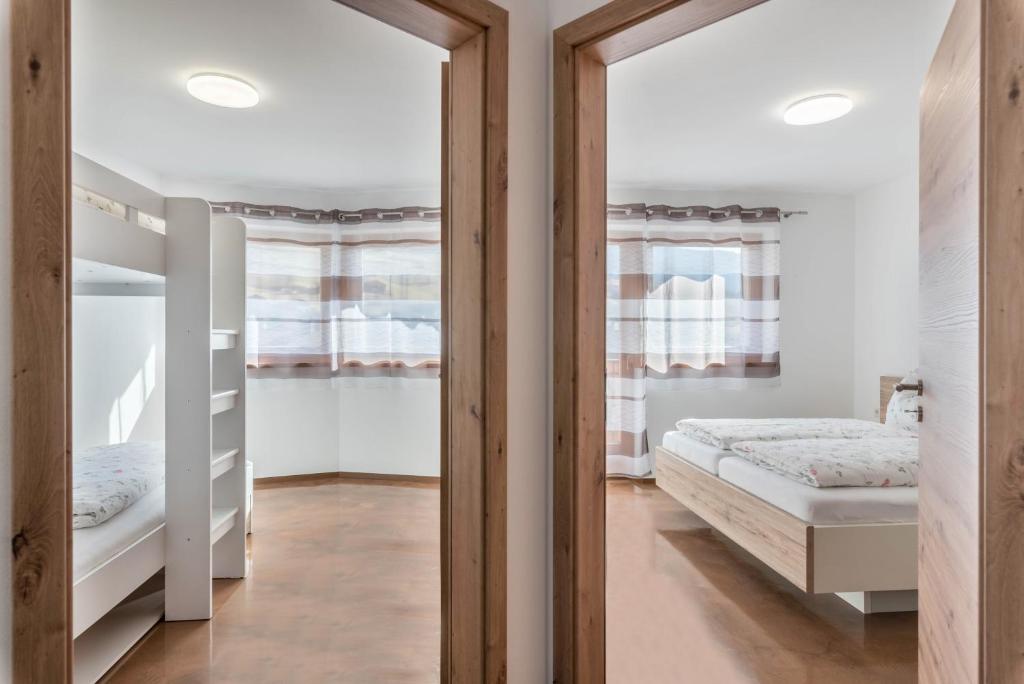Posteľ alebo postele v izbe v ubytovaní Trojer Apartment 2