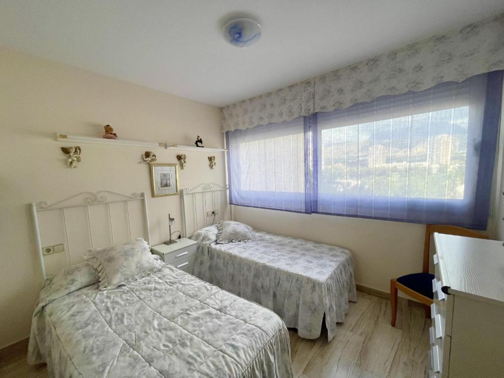 Postel nebo postele na pokoji v ubytování Miragolf Poniente Dreams