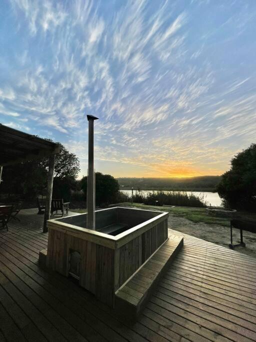 a wooden deck with a hot tub on top at Living The Breede-Lorigan House in Malgas