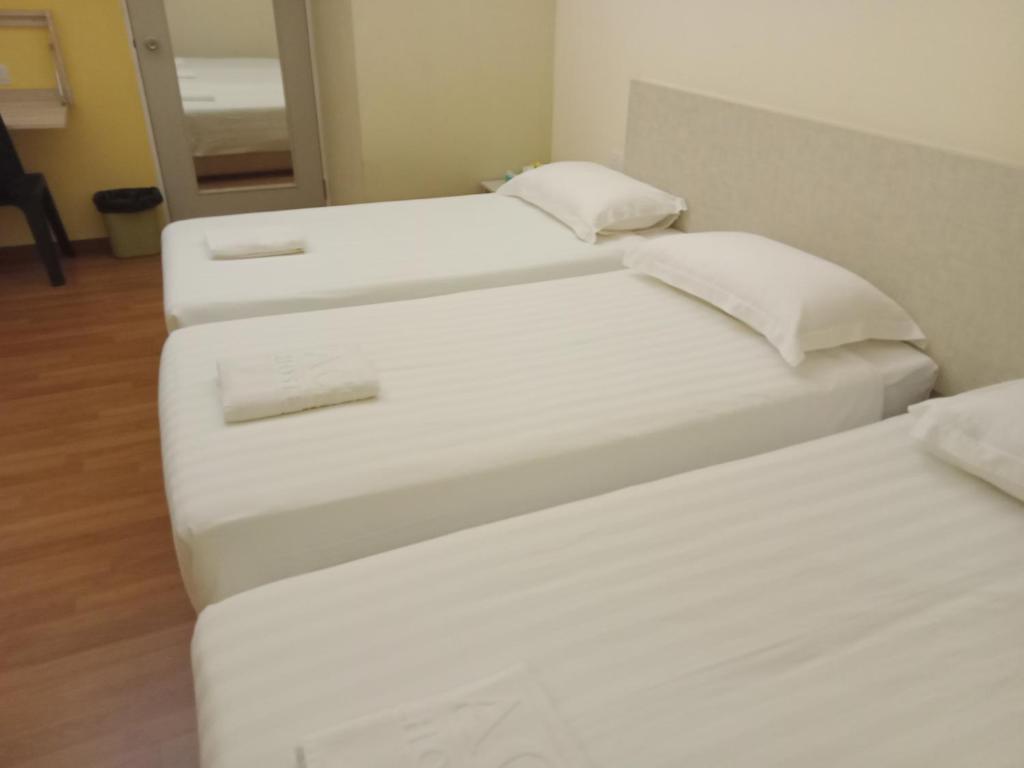 Postel nebo postele na pokoji v ubytování 1ACS Residence