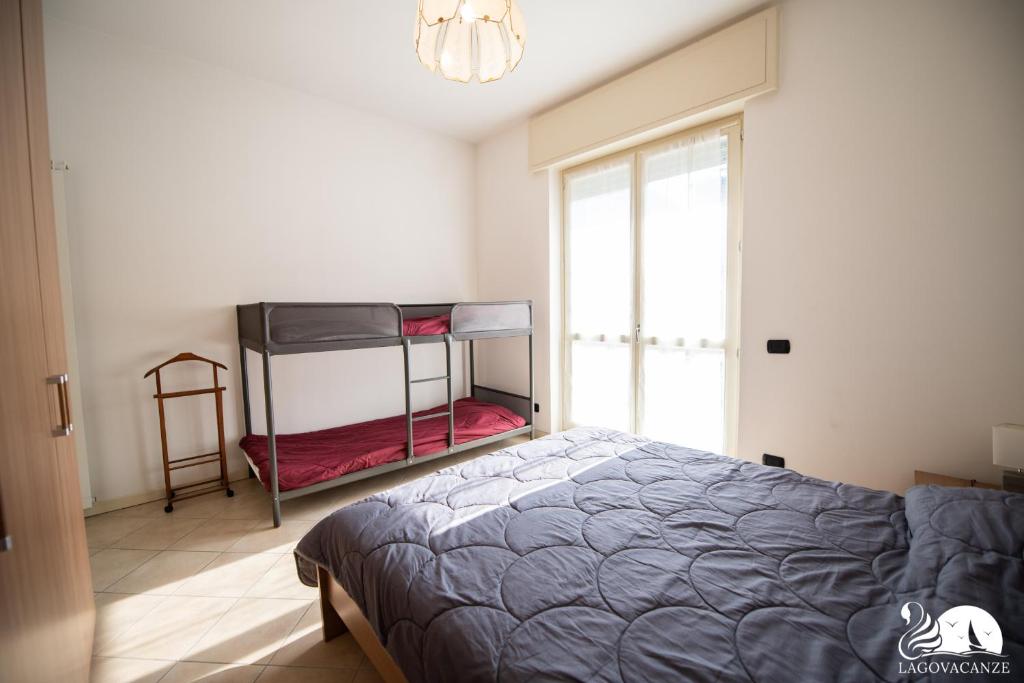 Posteľ alebo postele v izbe v ubytovaní Central Suite Moniga