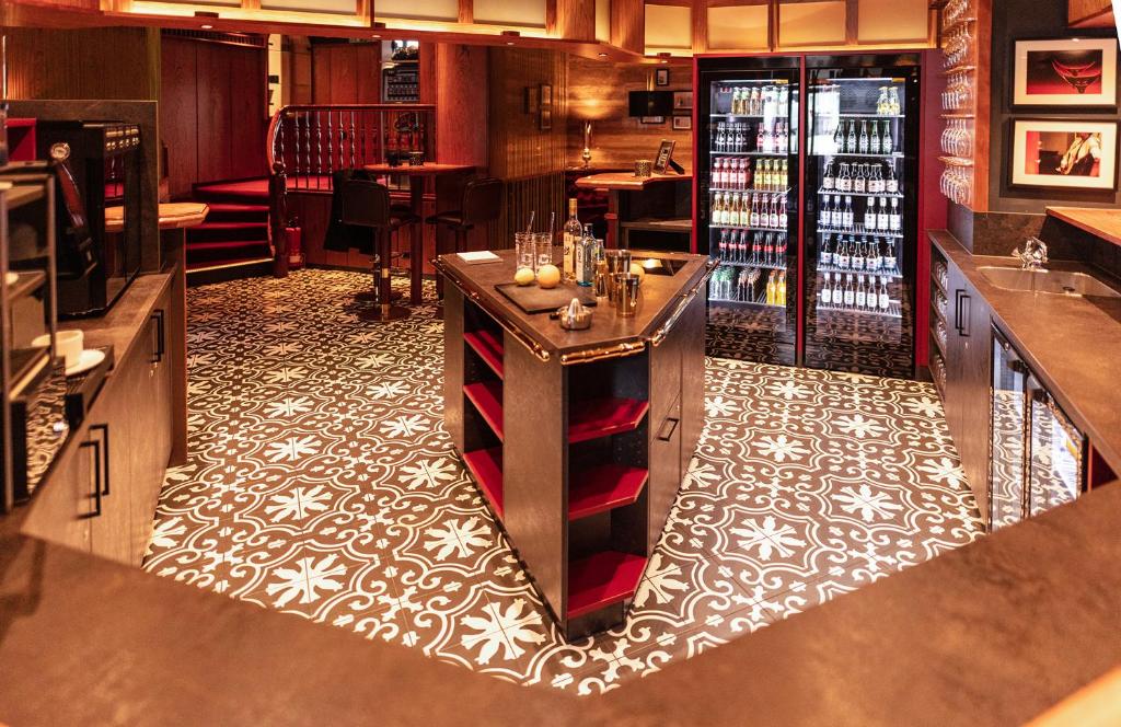 a bar with a counter in a wine tasting room at Hotel Haverkamp in Bremerhaven