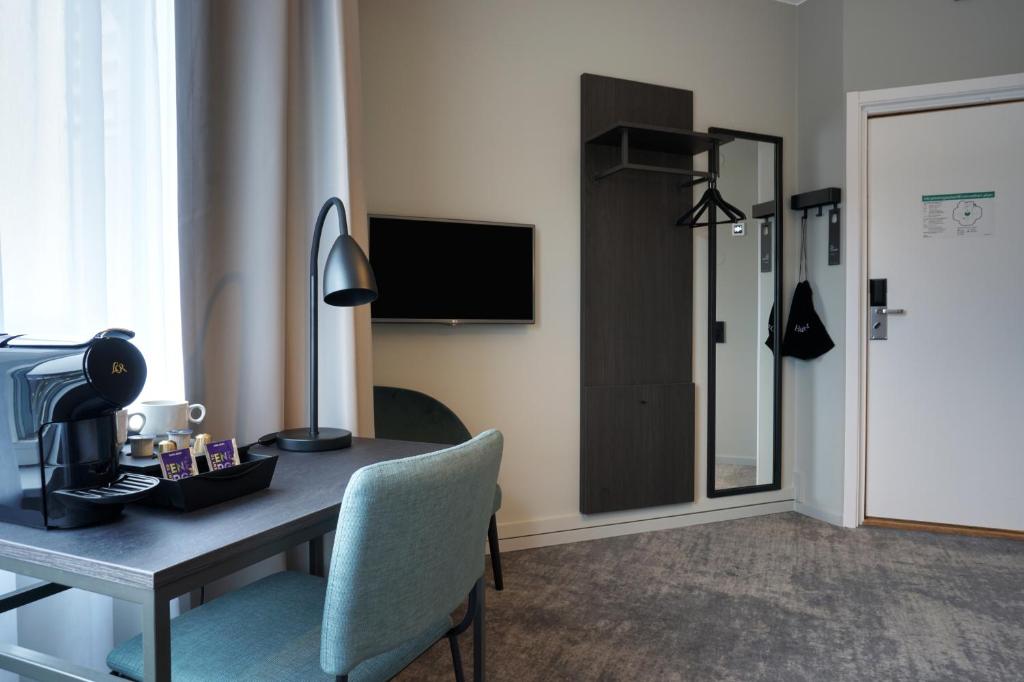 TV a/nebo společenská místnost v ubytování First Hotel Jönköping
