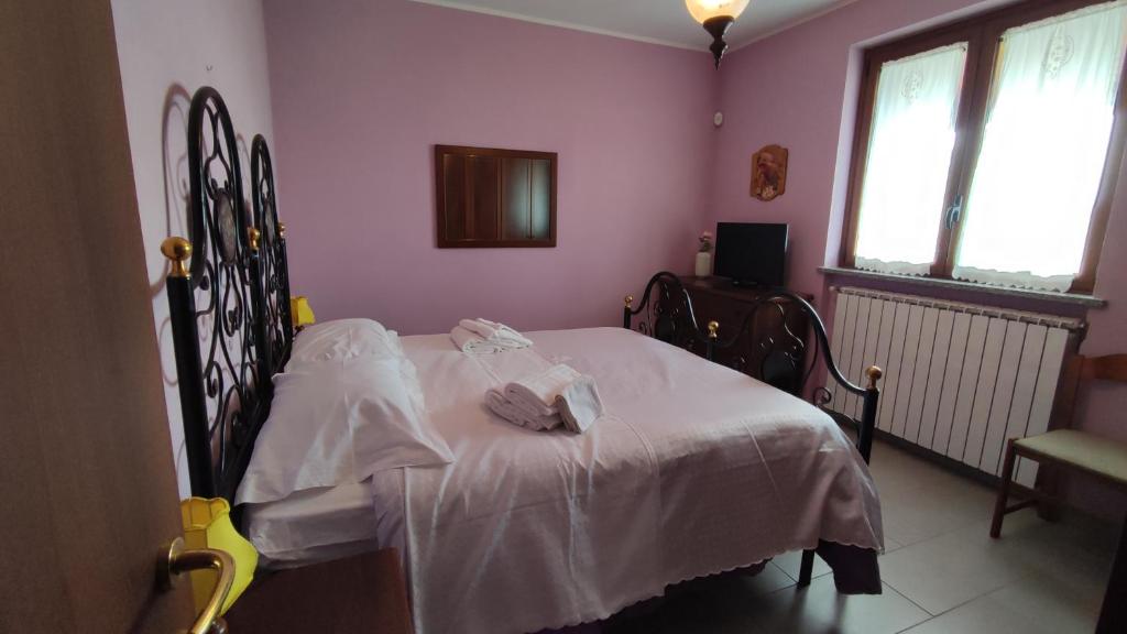 מיטה או מיטות בחדר ב-Villa Chiera