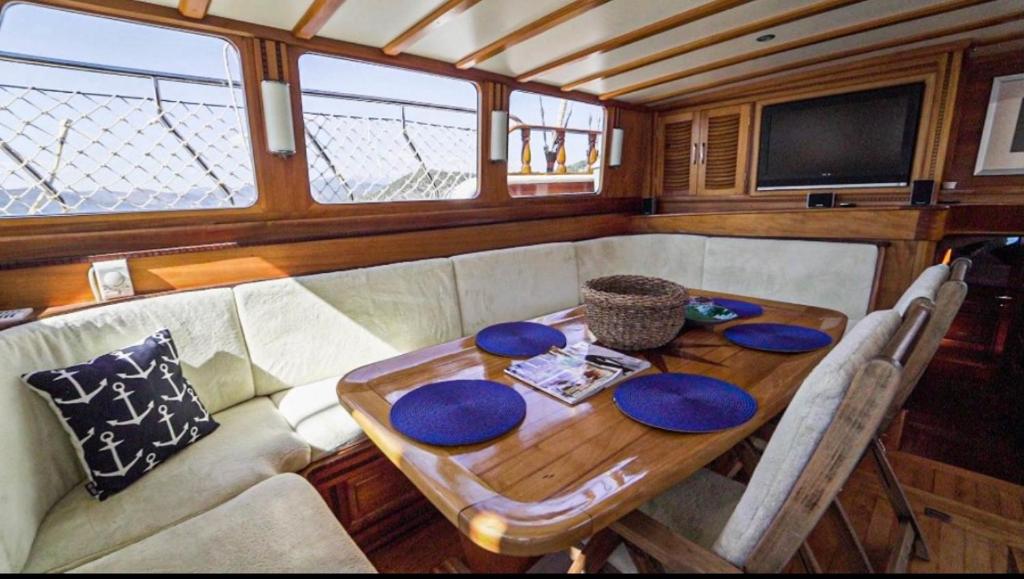 a wooden table in the back of a boat at Hka Neta Yachting in Fethiye
