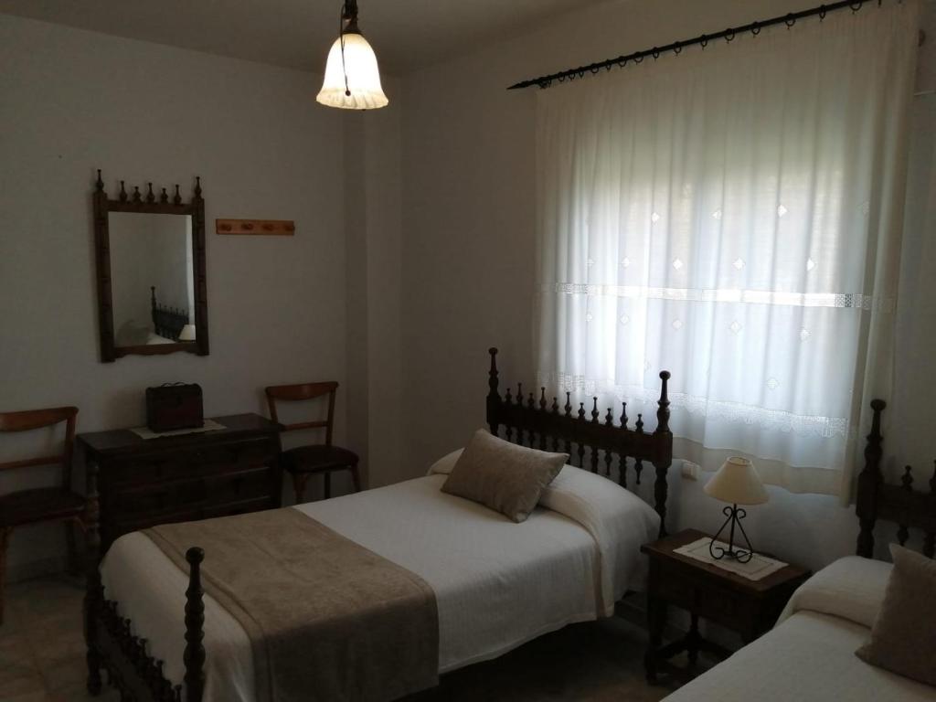 Postel nebo postele na pokoji v ubytování Casa rural Las Erillas