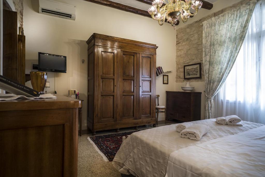 A bed or beds in a room at Il Calamaio
