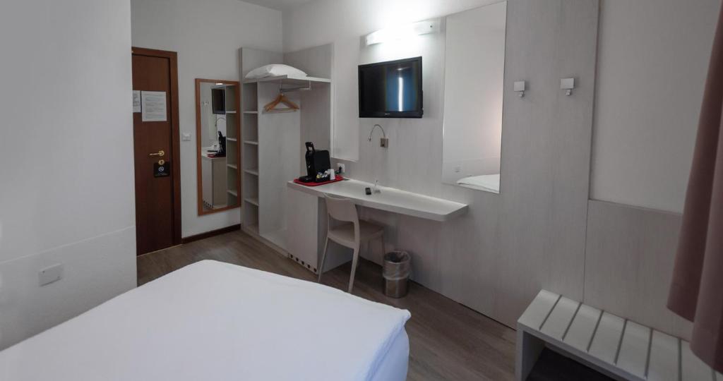 Letto o letti in una camera di Acquarello Swiss Quality Hotel