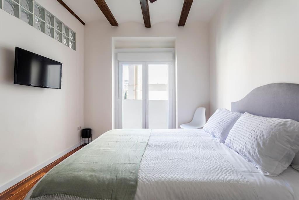 Postel nebo postele na pokoji v ubytování 7P céntrico piso con encanto