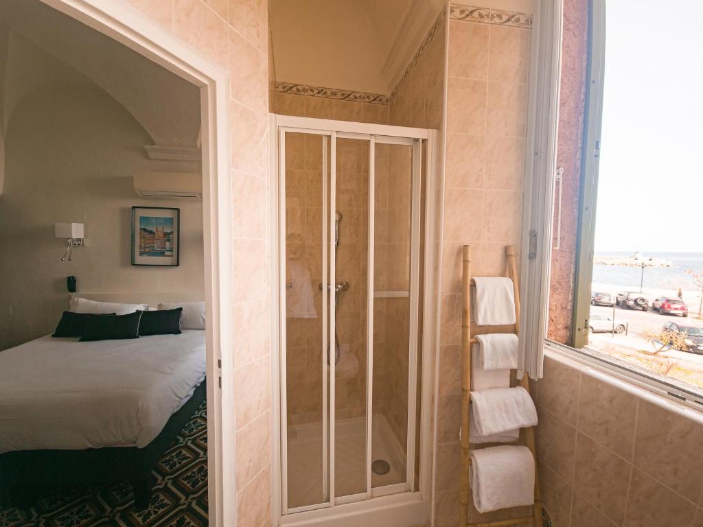 Postel nebo postele na pokoji v ubytování Hôtel Posta Vecchia