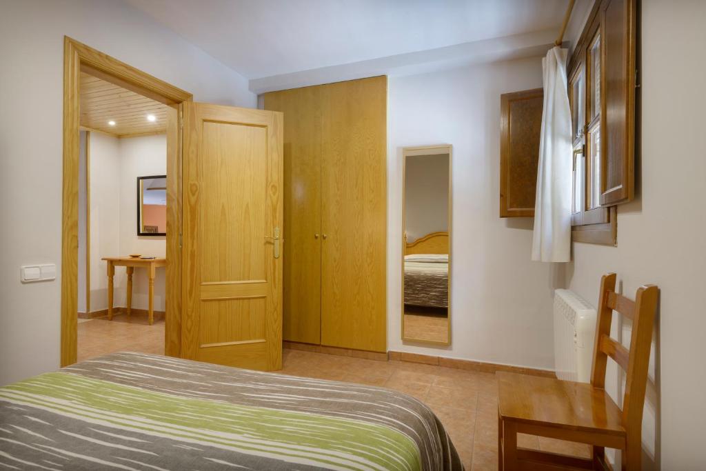 Cama o camas de una habitación en Apartamentos Casa Aurelia