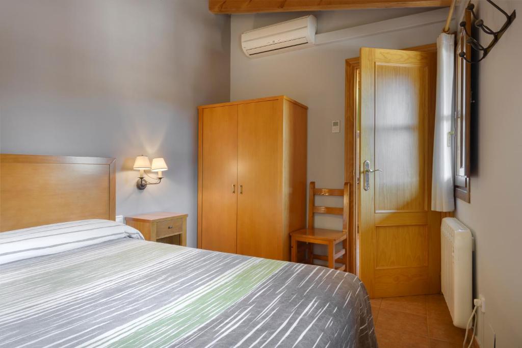 Cama o camas de una habitación en Apartamentos Casa Aurelia