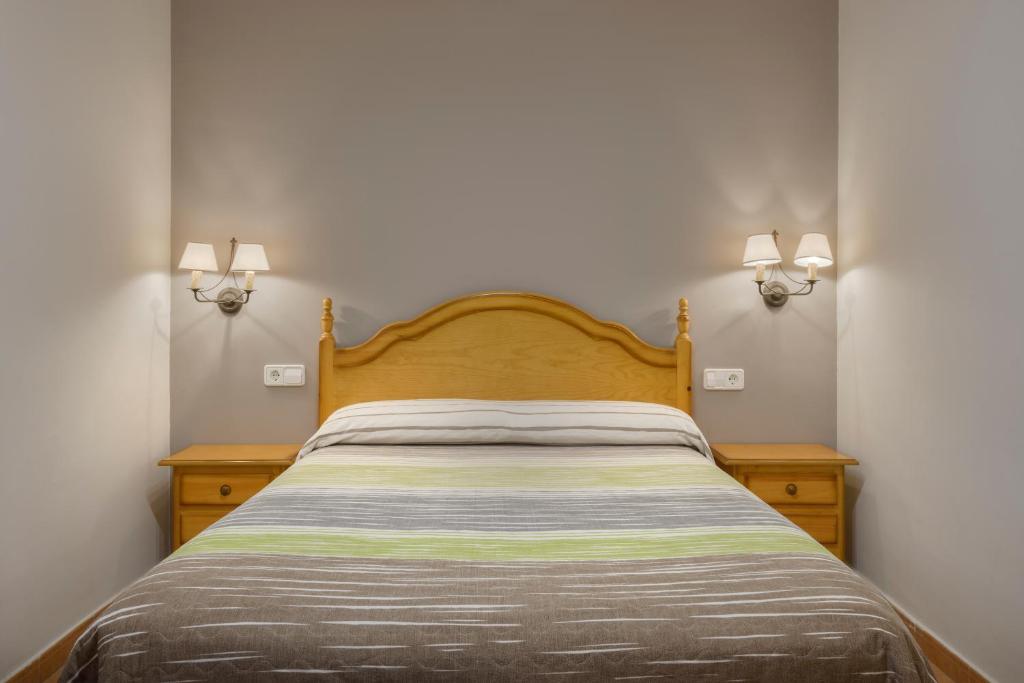 Cama o camas de una habitación en Apartamentos Casa Aurelia