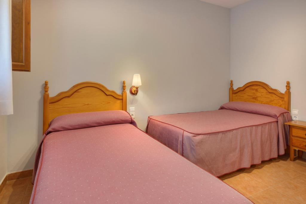 Cama o camas de una habitación en Apartamentos Casa Aurelia
