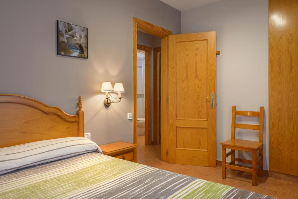 Cama o camas de una habitación en Apartamentos Casa Aurelia