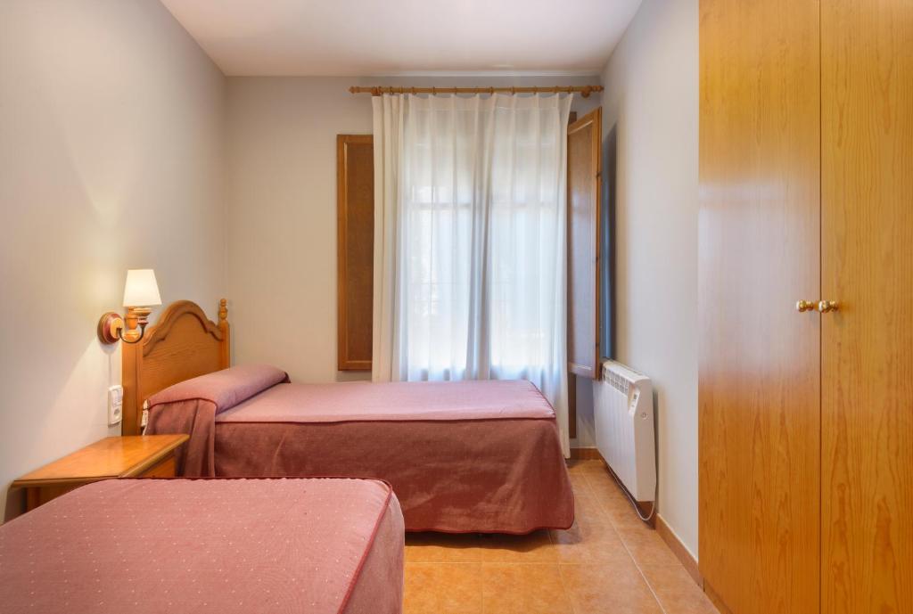Cama o camas de una habitación en Apartamentos Casa Aurelia