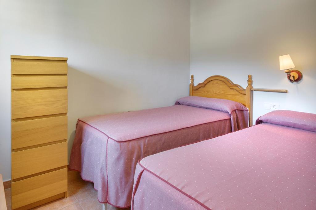 Cama o camas de una habitación en Apartamentos Casa Aurelia