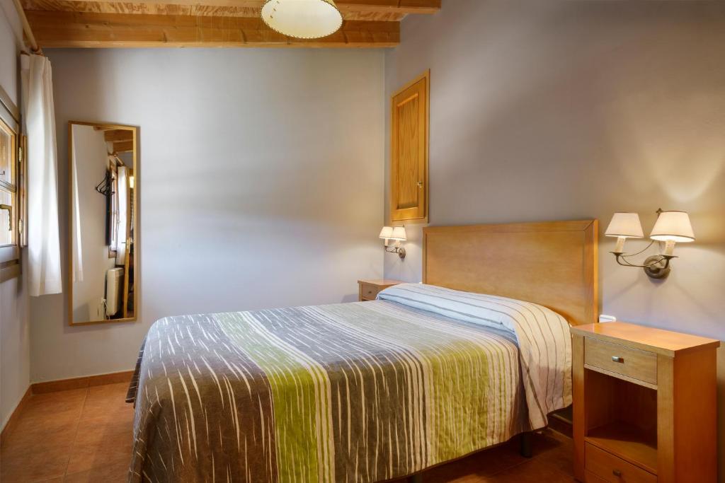 Cama o camas de una habitación en Apartamentos Casa Aurelia