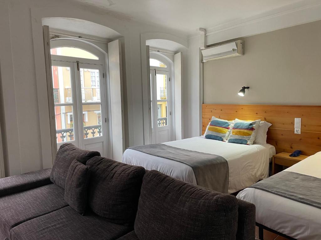 Postel nebo postele na pokoji v ubytování Hotel Ilha