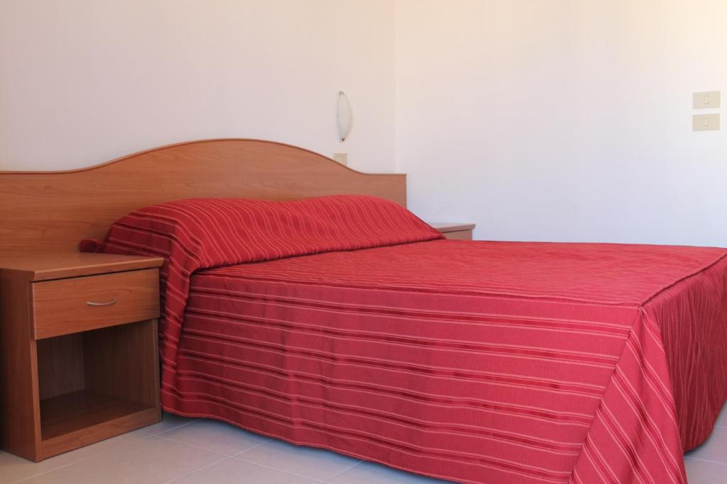 Postel nebo postele na pokoji v ubytování Hotel Vienna