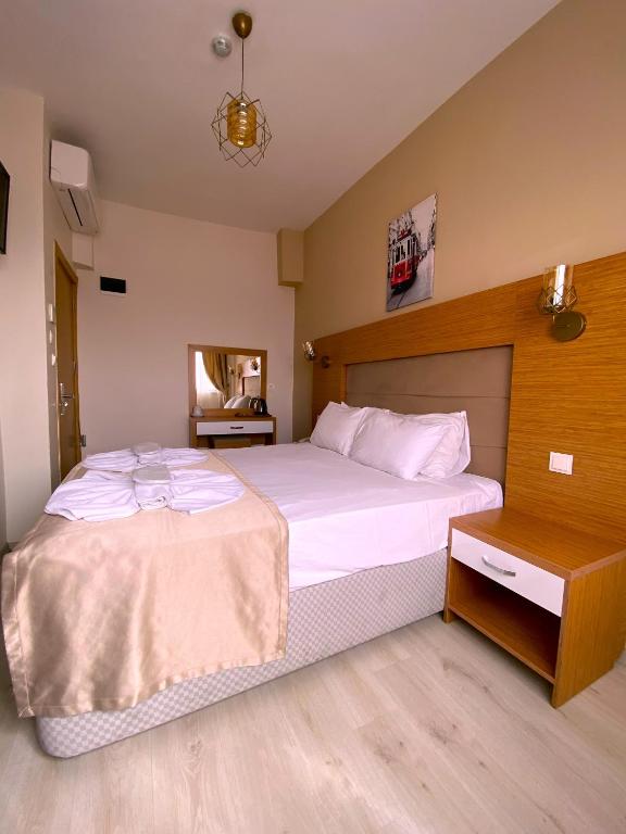 Postel nebo postele na pokoji v ubytování Zeyn Otel Istanbul