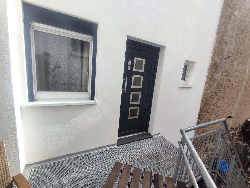 a stairway with a door and a window at Gästehaus im Alten Fährhaus in Cochem