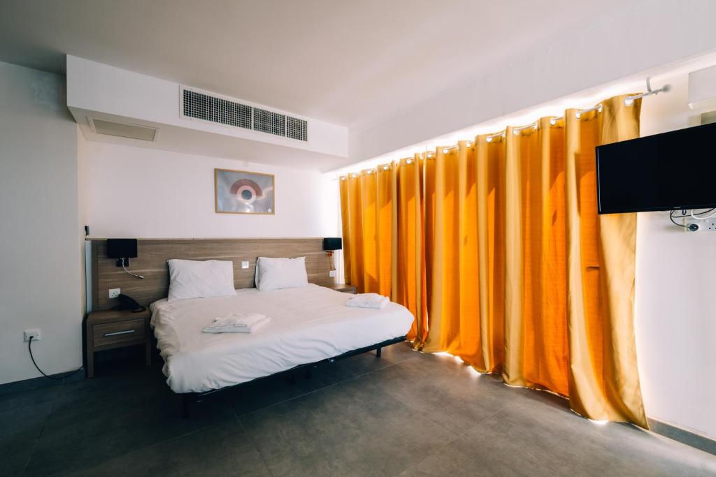 Postel nebo postele na pokoji v ubytování Primera Hotel