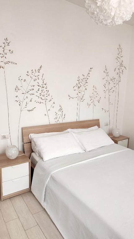 Postel nebo postele na pokoji v ubytování B&B Le Albarelle